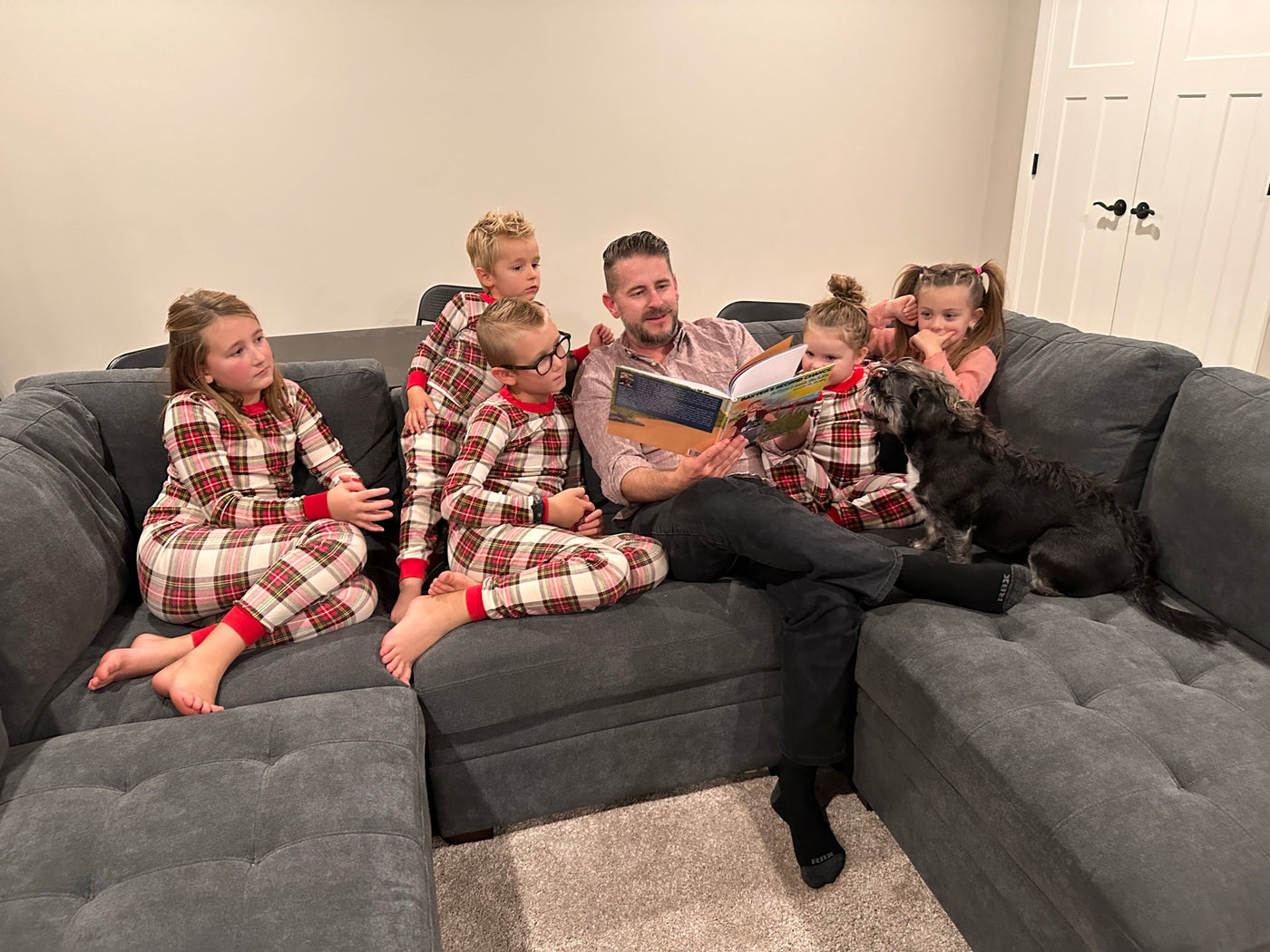 Family reading Baxter's Second Chance together with printable activities
